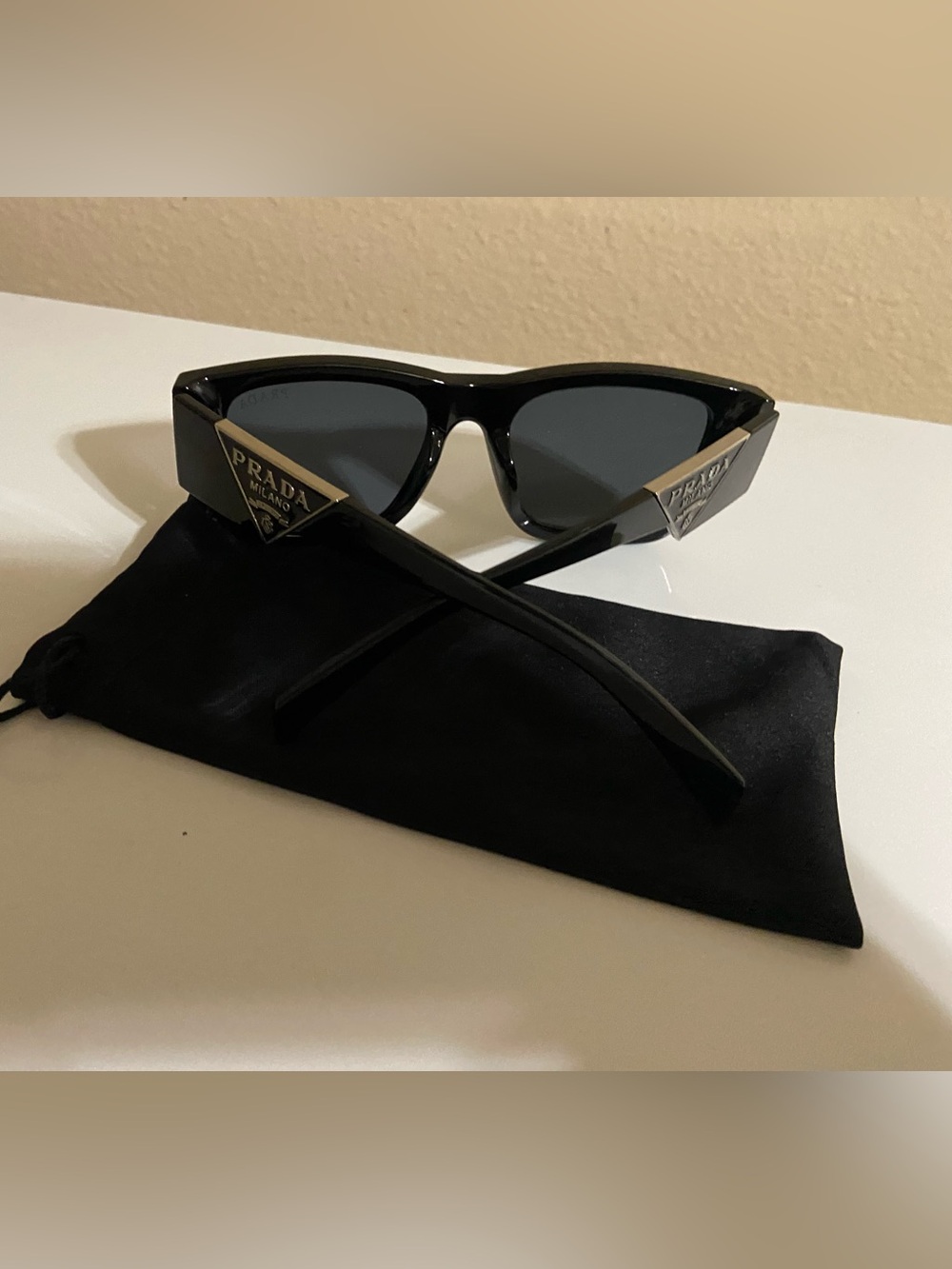 Prada Black Frame Sunglasses with Dark Gray Lenses
